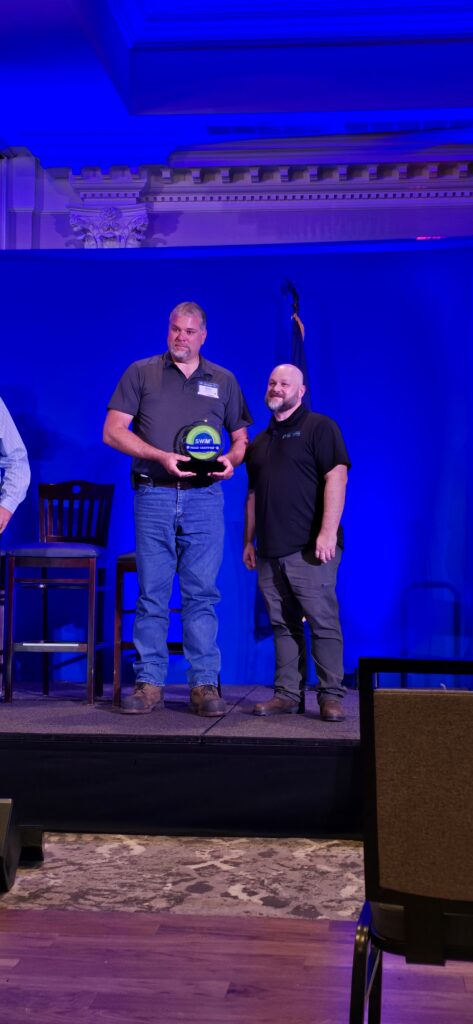 Mike Monroe, Town of Wilton DPW, Superintendent, receiving recognition from Rob Vopleus of Wit Advisors